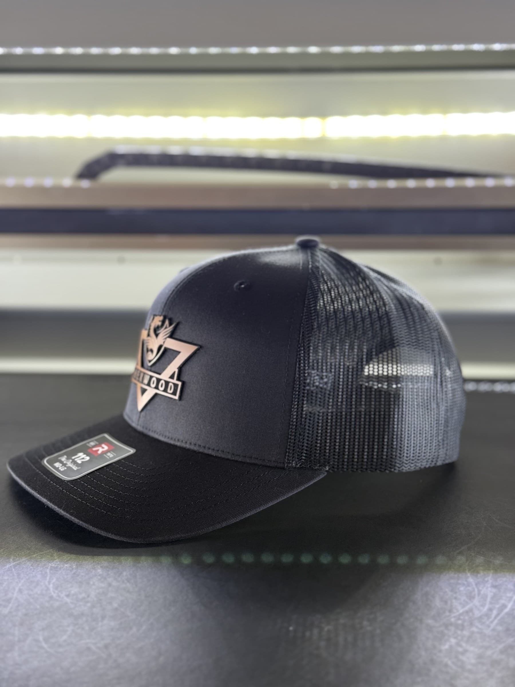 Crest (Black, 112 Curved Bill) Hexwood hat outdoors